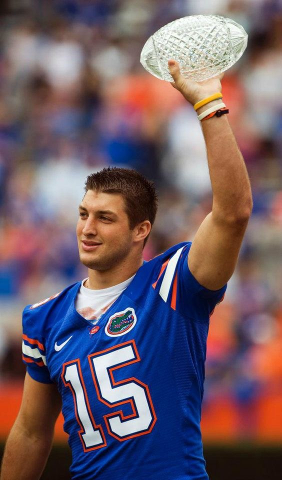 Tebow with National Championship Trophy | Donna Green-Townsend